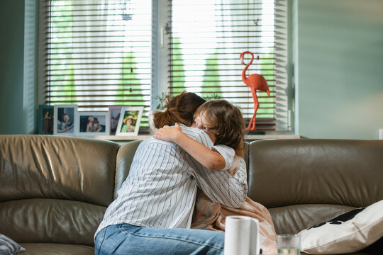 Mom hugs a sick child