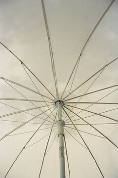 Film photography. White parasol and shadow pattern. Minimal