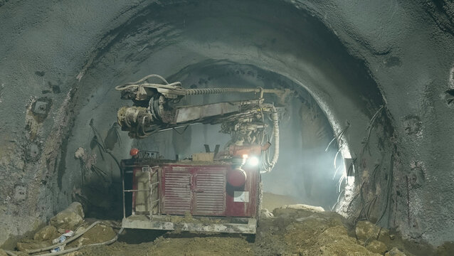 Work vehicle drilling in subway tunnel construction