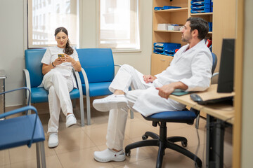 Medical staff taking a break in hospital office