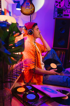 Man Relaxing with Vinyl Record