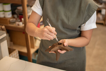 Hands of a Woman Creating a cavity