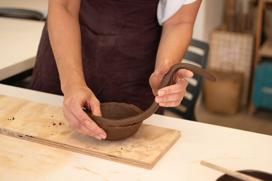 Hands of a Woman Creating a Vase of Clay