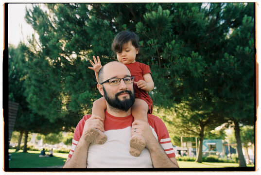 Toddler on father's shoulders