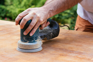 Sanding an oak table