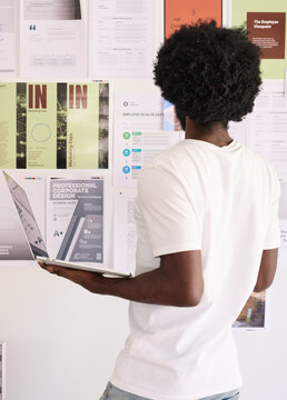 Designer evaluating print layouts