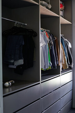 Organized closet with spacious clothing and folded items