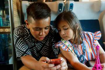 Two children using smartphone 