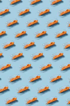 Seamless pattern of pills with visible content on blue background