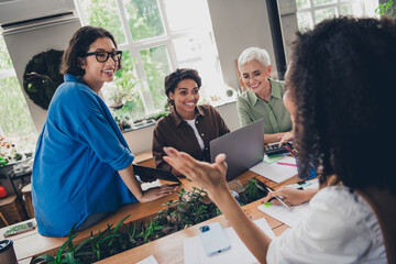 Portrait of team ambitious business women speak smile collaborate modern interior office indoors