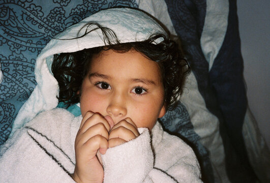 "Child Wrapped in Towel