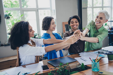 Photo of corporate four colleagues women feminists community give high five leadership meeting...