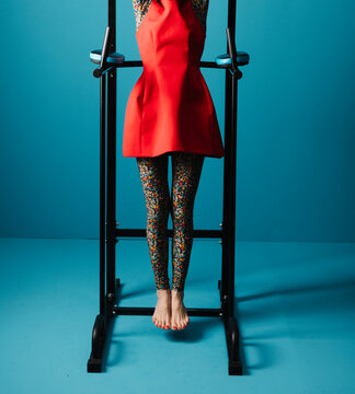 Woman in Floral Leggings Exercising on Pull-Up Bar