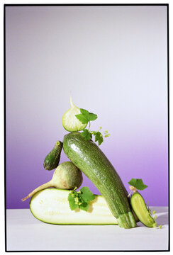 Creative composition of zucchini on a bright background