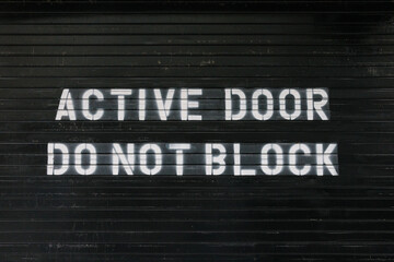 Active door with "Do Not Block" sign, New York City