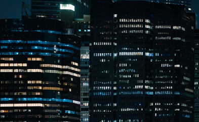 City buildings illuminated at night in New York City