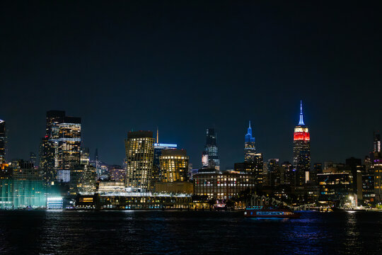 New York City skyline illuminated at night, vibrant cityscape vi