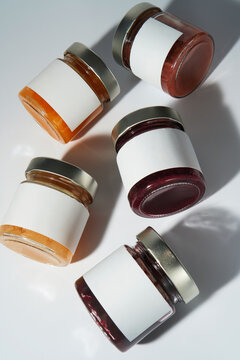 Glass Jars with blank white labels. Minimalistic product mockup