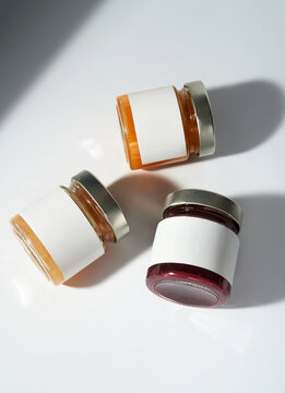 Glass Jars with blank white labels. Minimalistic product mockup