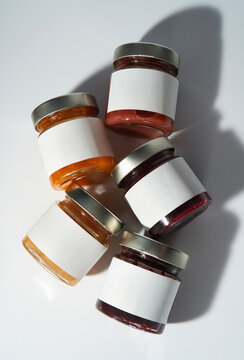 Glass Jars with blank white labels. Minimalistic product mockup