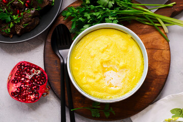 Corn porridge with butter in a deep bowl.selective focus
