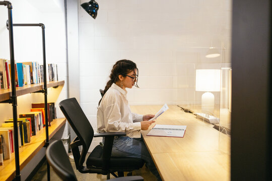 Woman working late in the office, doing overtime