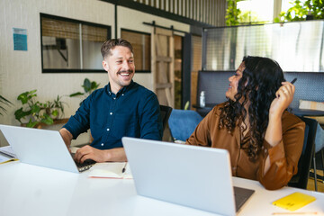 Colleagues Co-working In The Office