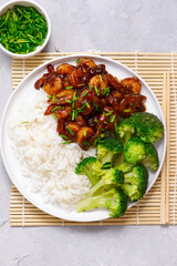 Shrimps in soy-honey sauce with rice and broccoli.selective focus
