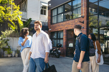 Coworkers saying goodbye at the office door