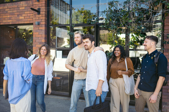 Coworkers saying goodbye at the office door