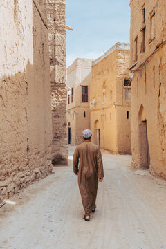 Man Walking Through the Streets of Al Hamra