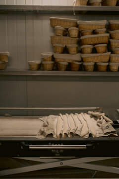 Proofed dough pieces covered with cloths in kitchen