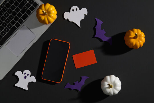 Halloween Desk with Laptop, Pumpkins, Phone and Decorations