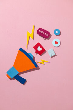 Colorful Megaphone With Social Media Icons on Pink Background