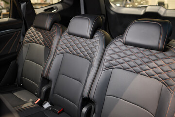 Obraz premium Car back seat with headrest and arm rest, a comfortable automotive fixture