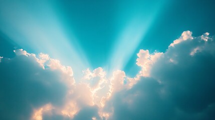 Sunlight illuminating clouds in a vibrant blue sky