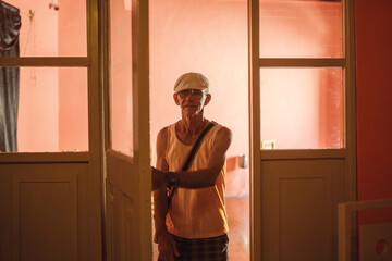 Man standing at bar entrance