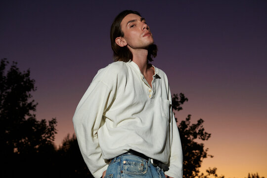 Young man in a beautiful sunset day 