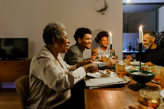 Happy family enjoying Christmas dinner together at home