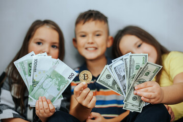 Kids Showing Off Money and Bitcoin