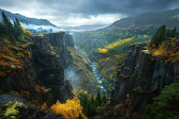 Breathtaking autumn landscape of a misty canyon with lush pine trees, vibrant fall foliage, and a flowing river under a dramatic overcast sky.