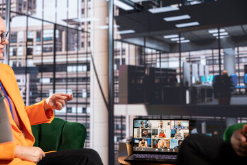 Multicultural team of businesswomen leads an online presentation, showcasing their leadership and success in a remote work environment. Sharing ideas with their boss on video call.