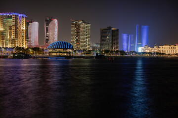 Fototapeta premium Lusail marina night view with Yachts and boats with Qatar flag and Lusail skyline in background