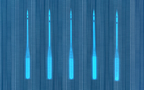 Five sewing machine alongside parallel pencil lines