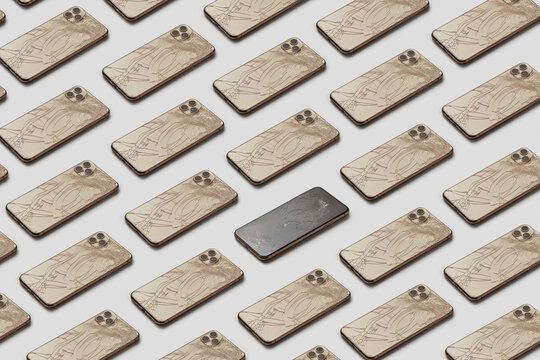 Horizontal rows ob crashed cellular phones with one unbroken device