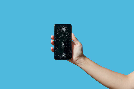 Mobile telephone with scratches and breaks in palm of human