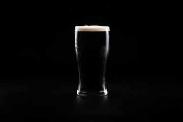 Pint of Irish Stout on a Black Background