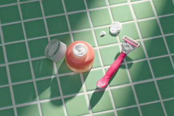 Razor With Shaving Cream On Green Tiled Surface