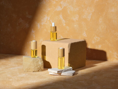 Trio of oil bottles displayed on stone block