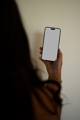 Minimalistic phone mockup in a woman's hand